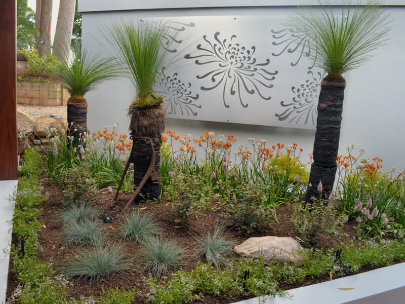 Formal garden landscaping with manicured beds and classical elements in Sydney