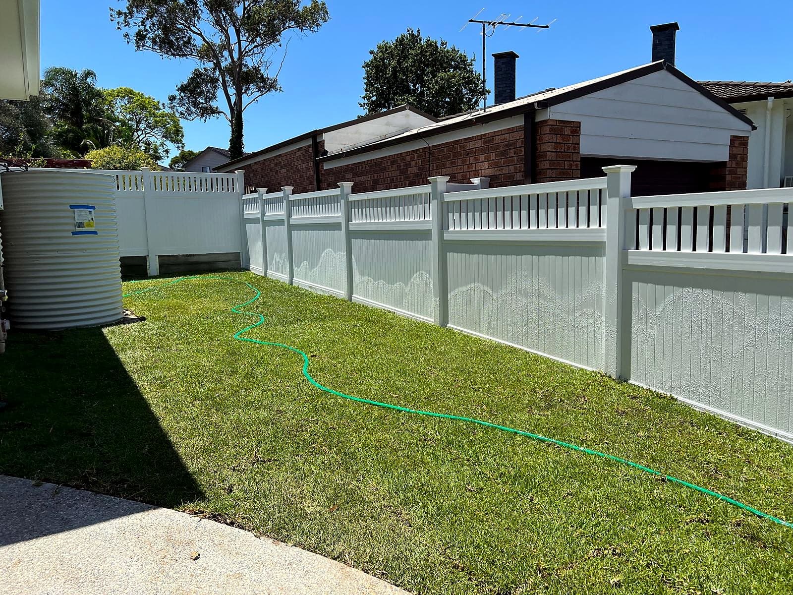 Completed front lawn and garden edge outside a brick home in Turramurra by Nazscapes